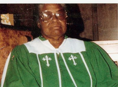 Minister
Sister Travis in her green robe.
